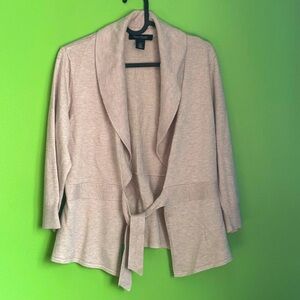 Cute sweater, open with tie in front.